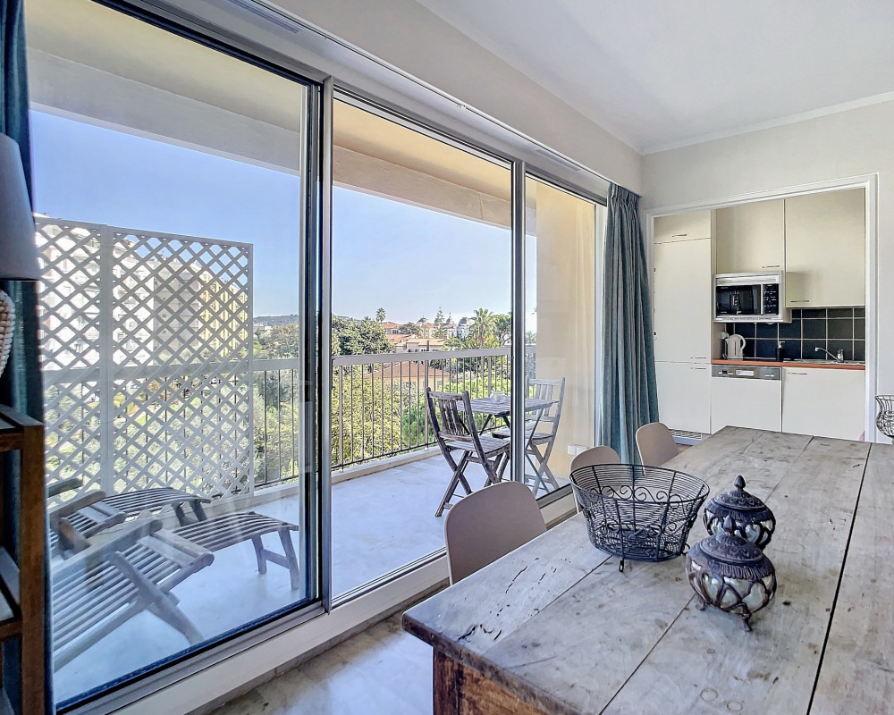 Top-floor apartment with a large terrace and views of the sea and hills.